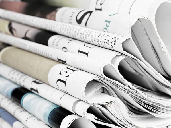 A selection of folded newspapers