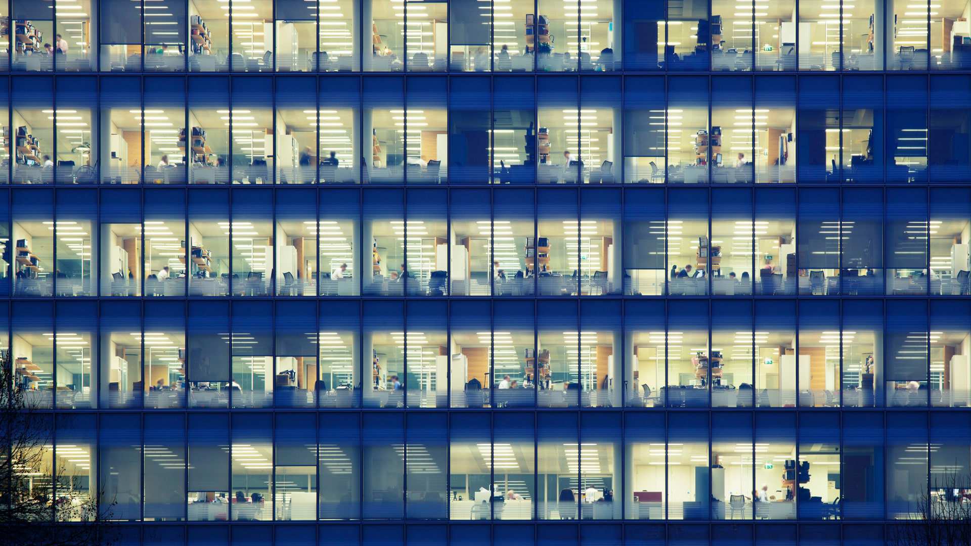 An office building lit up from the inside