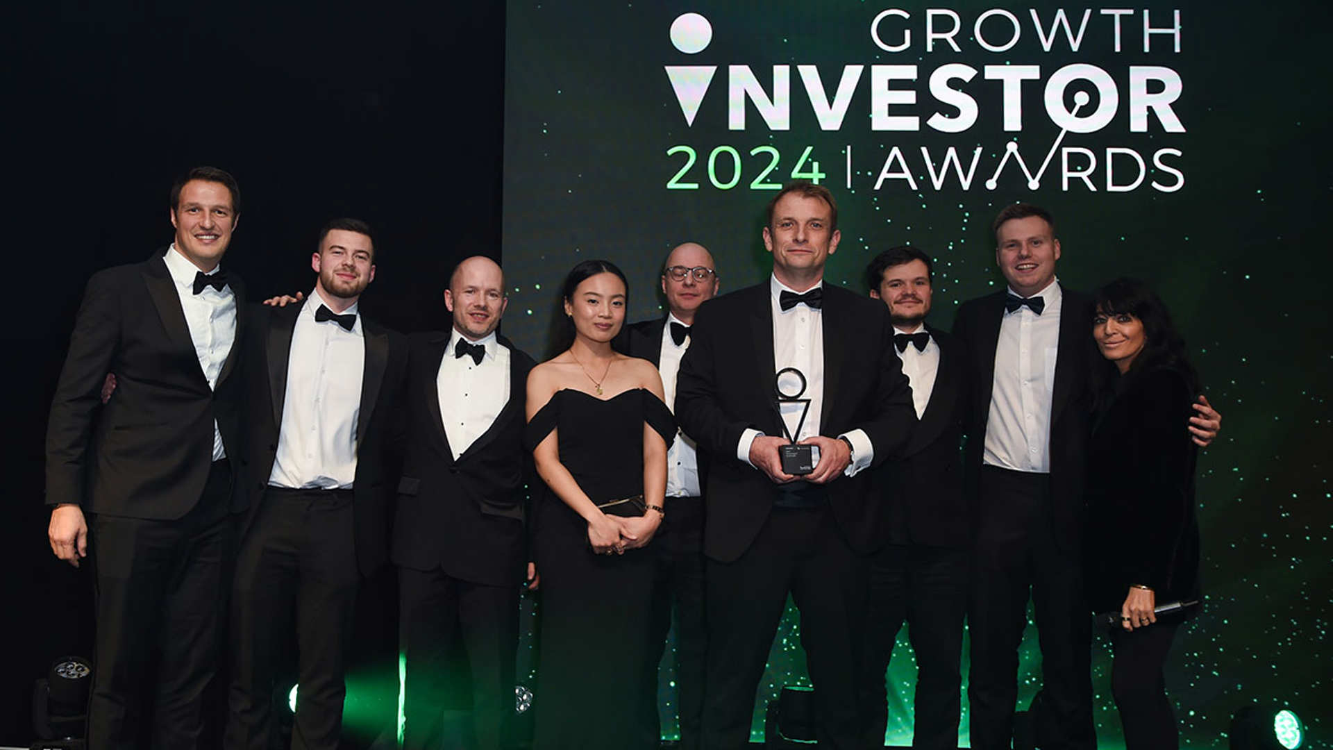 Wealth Club receiving Best Investment Platform at the Growth Investor Awards 2024. L-R: Tom Dimonaco, Bayley Royle, Mark Churchill, Alyssa Francisco, presenter, Alex Davies, Sheridan Leech, Ben O’Sullivan, Claudia Winkleman
